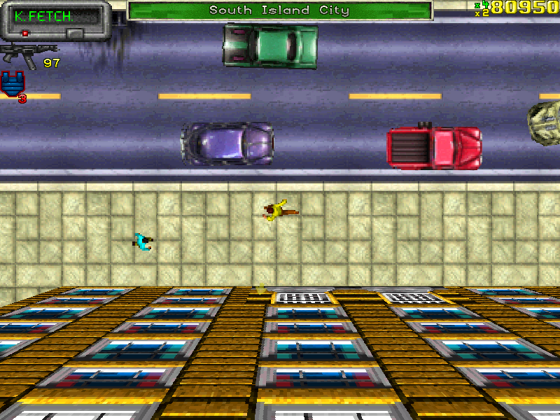 Imagem do jogo Grand Theft Auto (GTA) original, lançado em 1997. A visão é aérea, mostrando uma rua com carros coloridos circulando, incluindo um carro verde, um roxo e um vermelho. Na calçada, há dois personagens: um vestindo amarelo segurando uma arma e outro de azul. O minimapa no canto superior esquerdo exibe informações do jogador, como munição e vida. O nome da cidade, "South Island City", aparece na parte superior da tela, indicando a localização do jogador. Os gráficos são pixelizados, característicos da época.